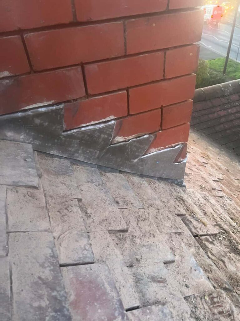 This is a photo of new leadwork being installed around an old chimney. Works carried out by TRP Roofing North Ferriby